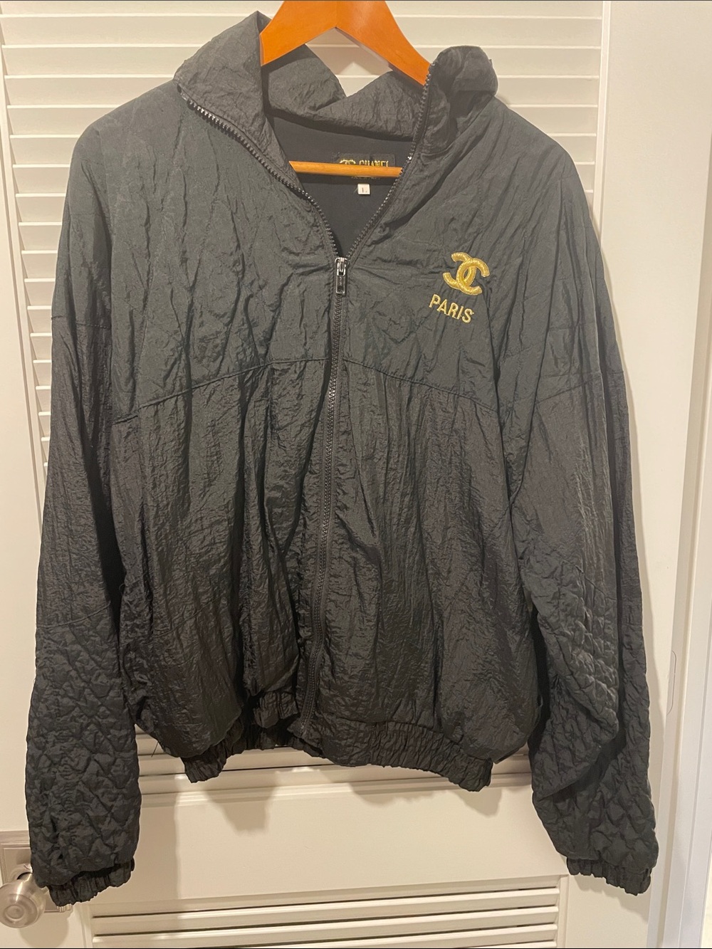 CHANEL Black Quilted Hooded Windbreaker with Gold Logo
